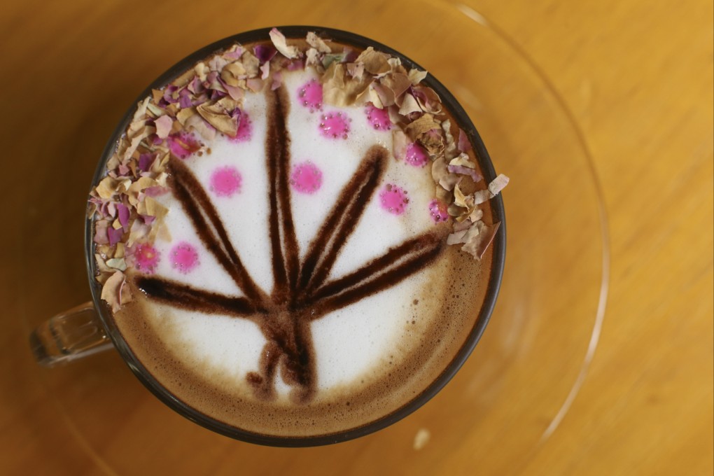 Floral latte art by May Man Kwai-fong at Coffee Lover in Kwun Tong. Fancy coffee shops have spread everywhere in Hong Kong, but can they all survive? Photo: Edmond So