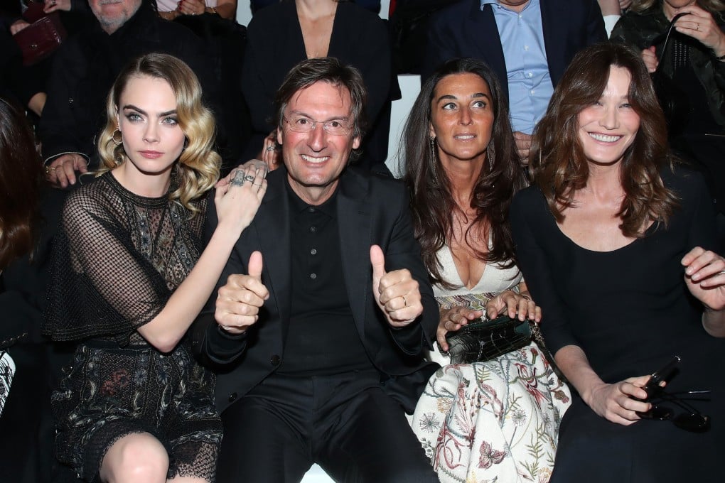 Dior CEO and chairman Pietro Beccari (second left) with (from left) Cara Delevingne, Becaari’s wife Elisabetta Beccari, and Carla Bruni at a Dior show during Paris Fashion Week in 2020. Photo: Getty Images