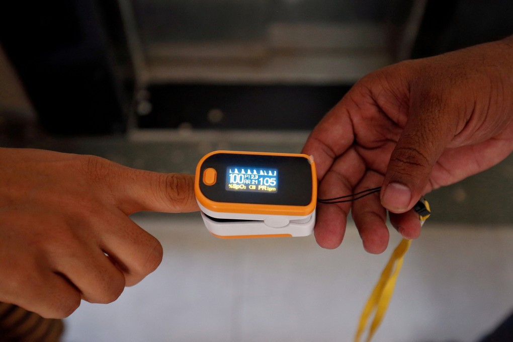 Pulse oximeters clip onto a fingertip and pass red and infrared light through the skin to gauge oxygen levels in the blood. File photo: Reuters