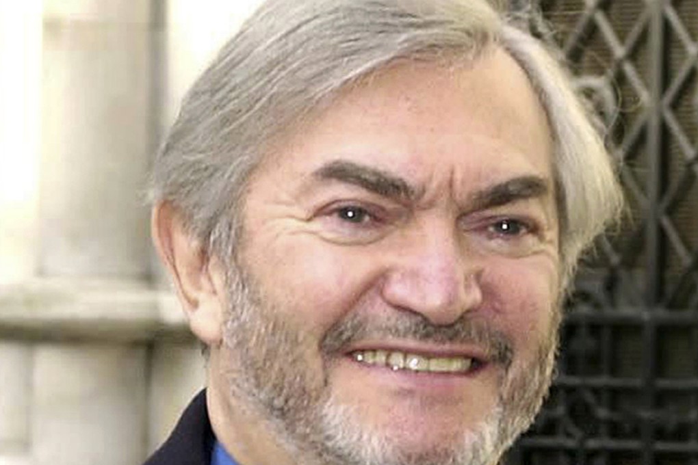 British composer Monty Norman is seen in a March 2001 photo. Photo: PA via AP