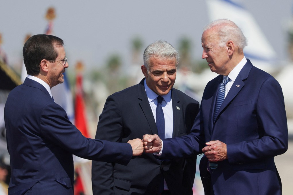 US President Joe Biden meets Israeli President Isaac Herzog and Israeli Prime Minister Yair Lapid at an airport near Tel Aviv. Photo: Reuters