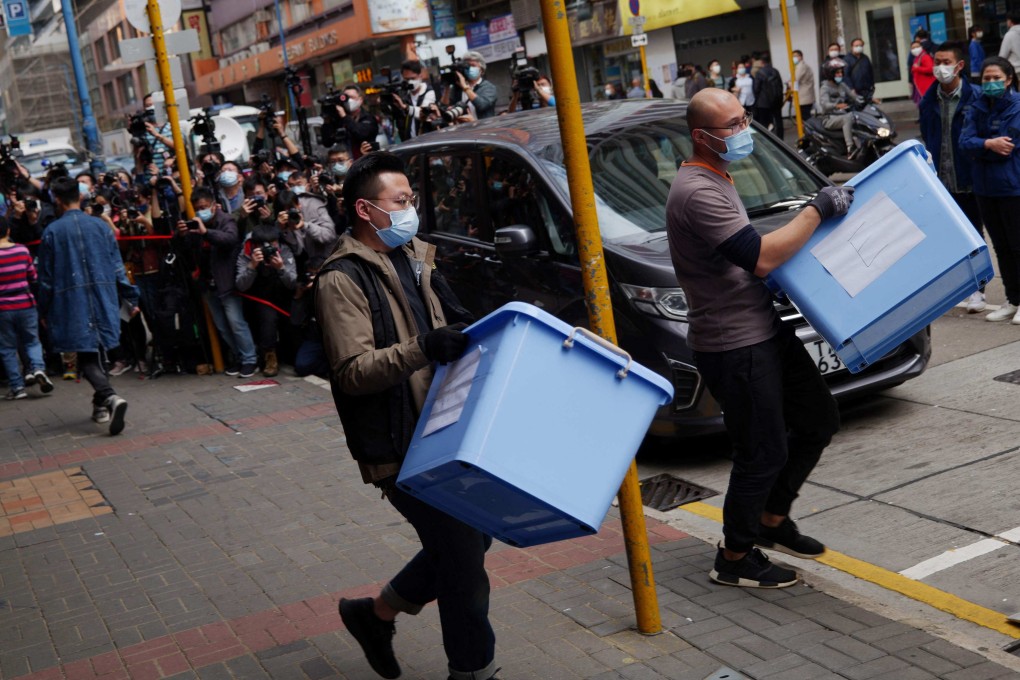 Police removing  boxes from the offices of Stand News in Hong Kong after raiding them and arresting staff members in 2021. On Tuesday, the US Congressional-Executive Commission on China heard suggestions for new actions to take in the wake of the national security law imposed on the city. Photo: AFP
