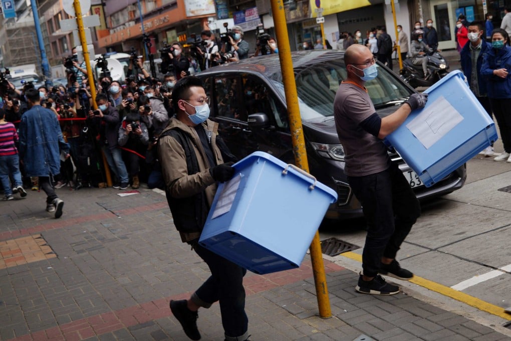 Police removing boxes from the offices of Stand News in Hong Kong after raiding them and arresting staff members in 2021. On Tuesday, the US Congressional-Executive Commission on China heard suggestions for new actions to take in the wake of the national security law imposed on the city. Photo: AFP