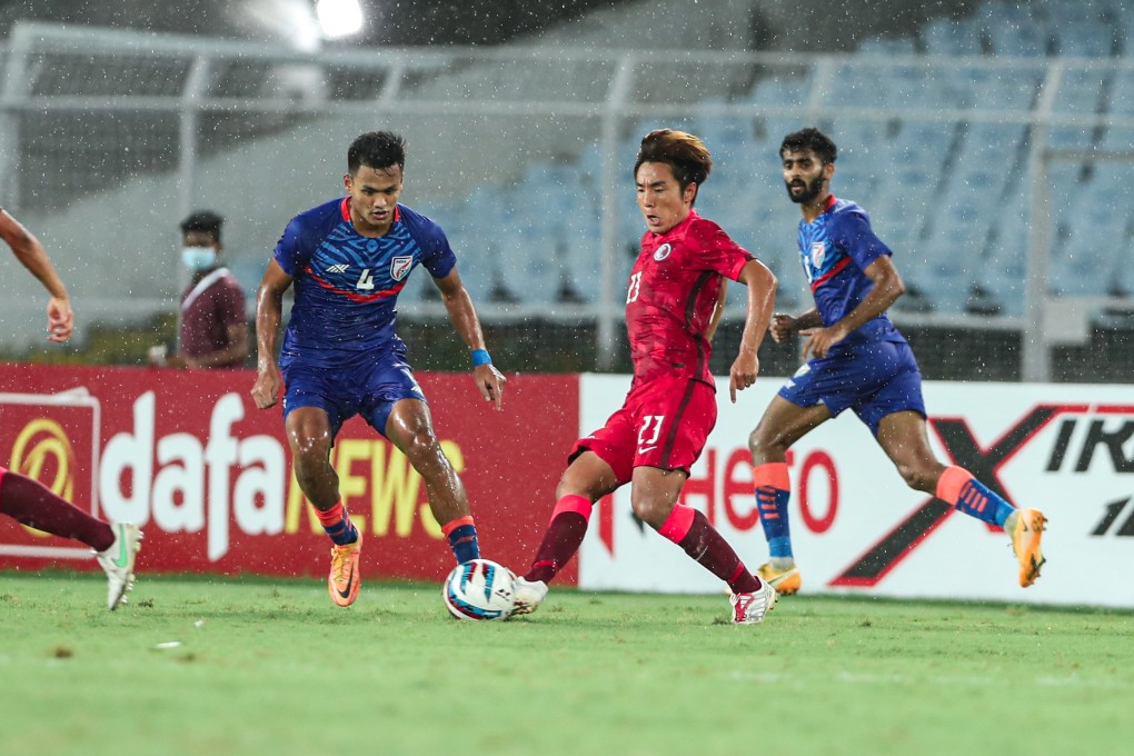 Hong Kong’s Ju Yingzhi (right) passes the ball as India’s Jeakson Singh Thounaojam closes in at Salt Lake Stadium in Kolkata, India, during their last Group D Asian Cup qualifier on June 14, 2022. Photo: HKFA