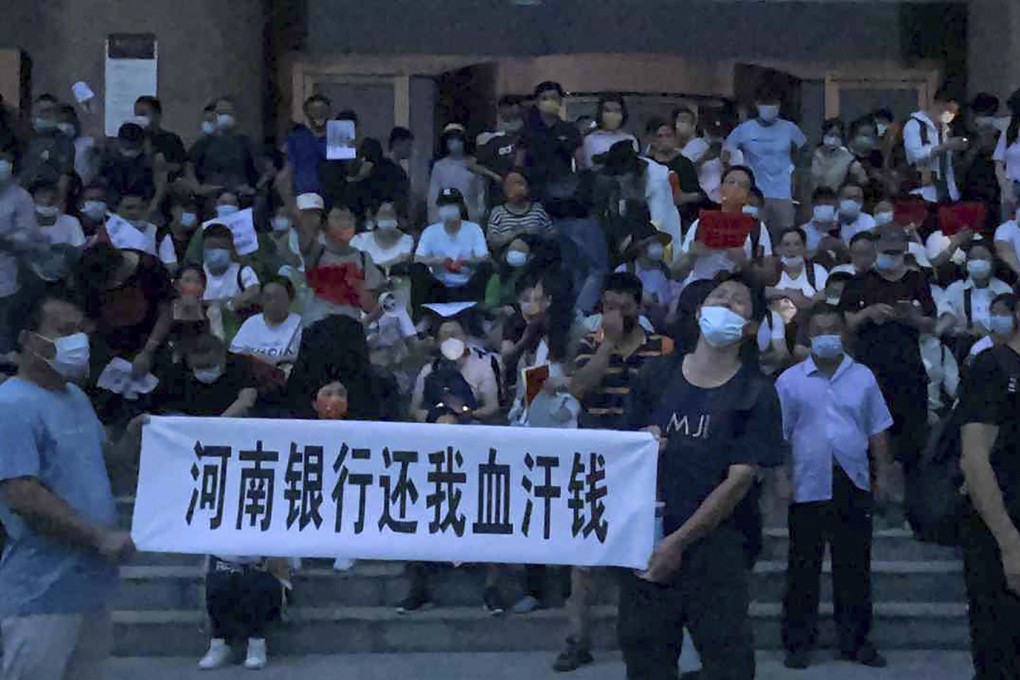 People attending Sunday’s protest by bank depositors in Zhengzhou, capital of central China’s Henan province say they have been contacted by their local police after returning home. Photo: AP