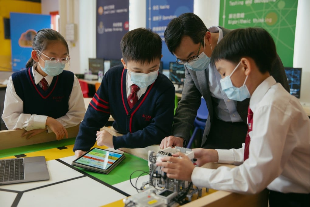 Leong Cheung (right), Executive Director of Charities and Community at The Hong Kong Jockey Club, meets students from the CoolThink@JC programme. Photo: HKJC