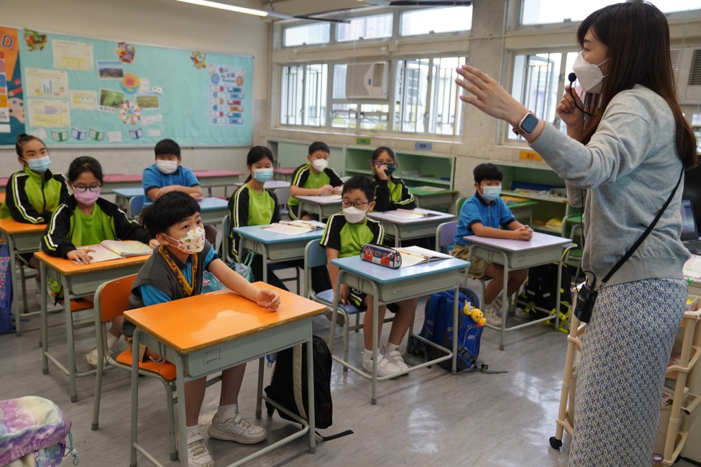 A teacher speaks to students during class at a primary school in Tsing Yi on April 22. The high rate of turnover among native English teachers in Hong Kong could be exacerbated by their facing a lower retirement age than their local counterparts. Photo: Sam Tsang