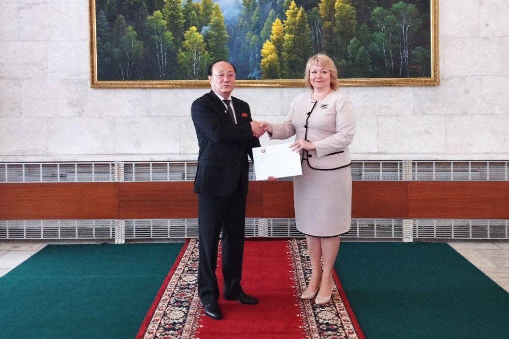 Donetsk People’s Republic (DNR) ambassador to Russia Olga Makeyeva receiving a letter of recognition from North Korea’s ambassador to Russia Sin Hong-chol at the DNR embassy in Moscow. Photo: Embassy of the self-proclaimed Donetsk People’s Republic