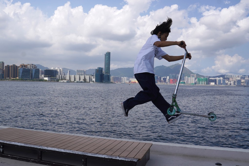 A boy does tricks on his scooter at the East Coast Park Precinct, North Point, on April 11. Photo: Sam Tsang