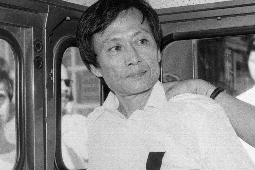 Law Kong (L) on his way back to prison. Law was sent back to the Portuguese enclave from Hong Kong. He would have to serve forty years in jail as he committed crimes, including murder, rape, wounding and robbery, in Macau in 1967. His identity was discovered only when he applied for a Hong Kong identity card.30JUL86 SCMP / Oliver Tsang