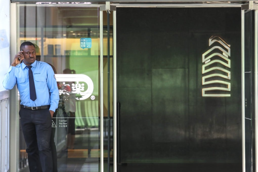 A security guard stands outside Citic Tower in Admiralty. Hong Kong should inclusively engage ethnic African minorities in the city’s development. Photo: Nora Tam