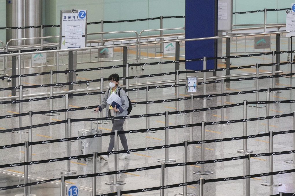 A lone traveller is seen at Hong Kong International Airport on July 7, 2022. The city’s travel restrictions have reduced the number of overseas visitors by 90 per cent since the start of the pandemic two years ago. Photo: Sam Tsang