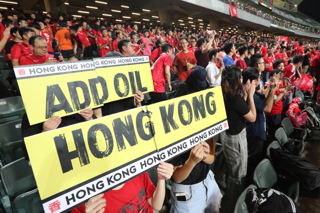 Football fans with an “add oil, Hong Kong” sign at the Hong Kong vs Iran 2022 Fifa World Cup qualifying match in Happy Valley, Hong Kong. Hongkongers should retake ownership of the phrase, which has recently been associated with anti-government protesters. Photo: Felix Wong