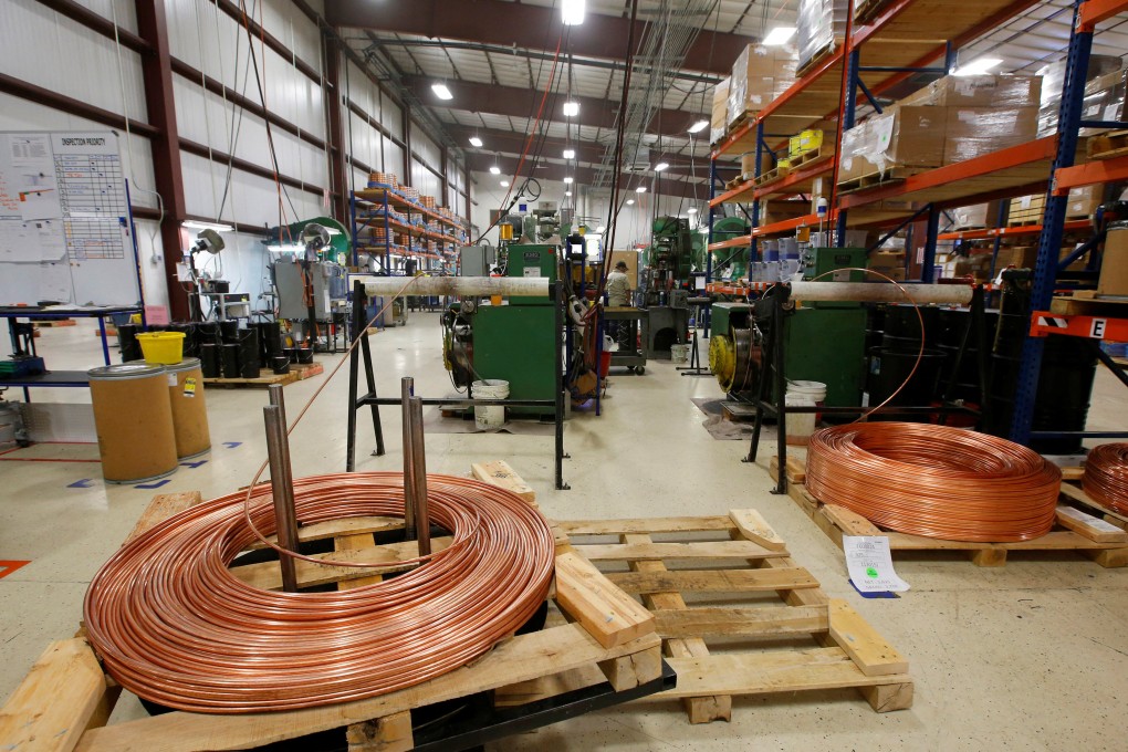 Large copper coils are cut into lengths to start the process of manufacturing a bullet at Barnes Bullets in Mona, Utah, January 6, 2016. Photo: Reuters