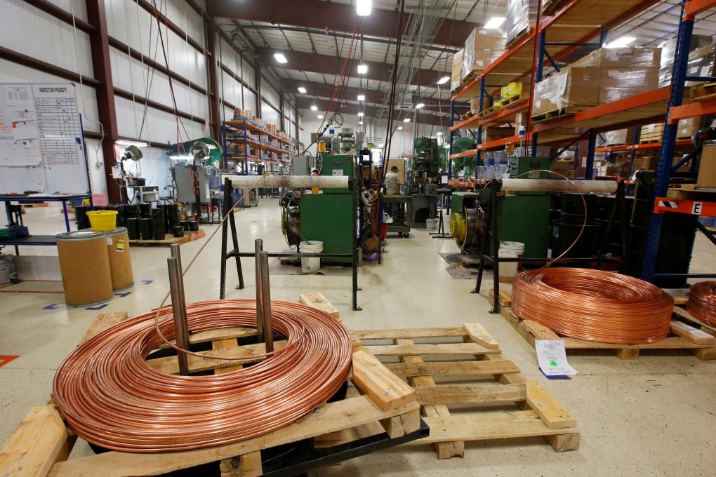 Large copper coils are cut into lengths to start the process of manufacturing a bullet at Barnes Bullets in Mona, Utah, January 6, 2016. Photo: Reuters