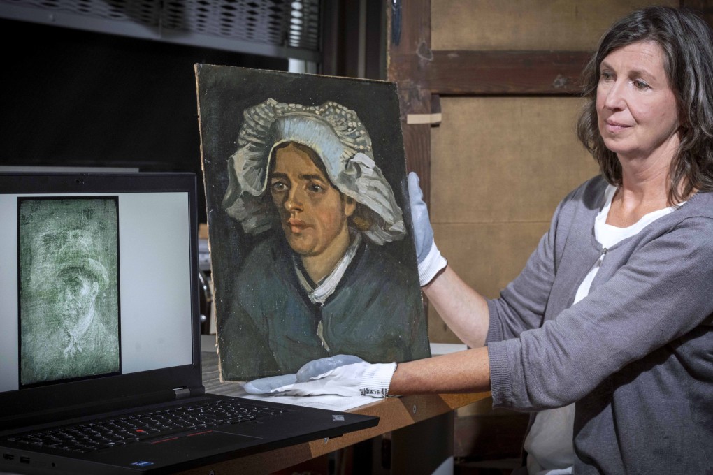 Senior Conservator Lesley Stevenson views “Head of a Peasant Woman” alongside an X-ray image of the hidden Van Gogh self portrait. Photo: Neil Hanna via AP