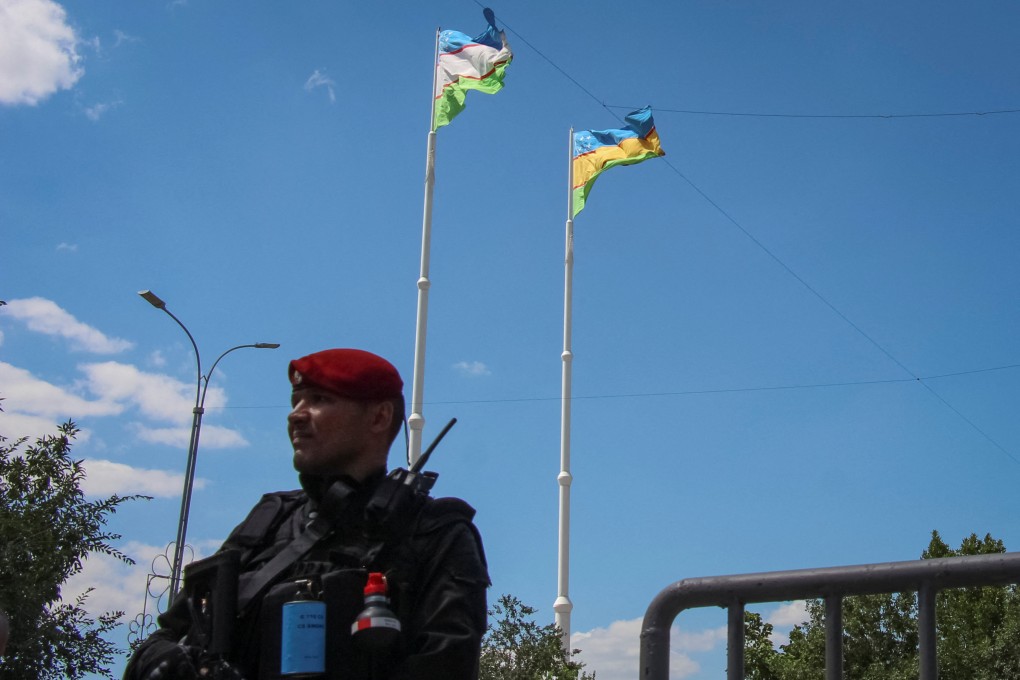 An Uzbek service member guards a road during a government-organised press visit in Nukus, capital of the northwestern Karakalpakstan region. Photo: Reuters