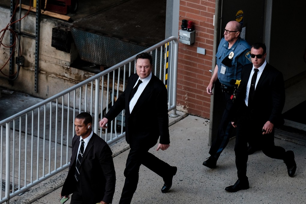 Elon Musk (centre) leaves a courthouse in Wilmington, Delaware, on July 12. Photo: Getty Images/TNS