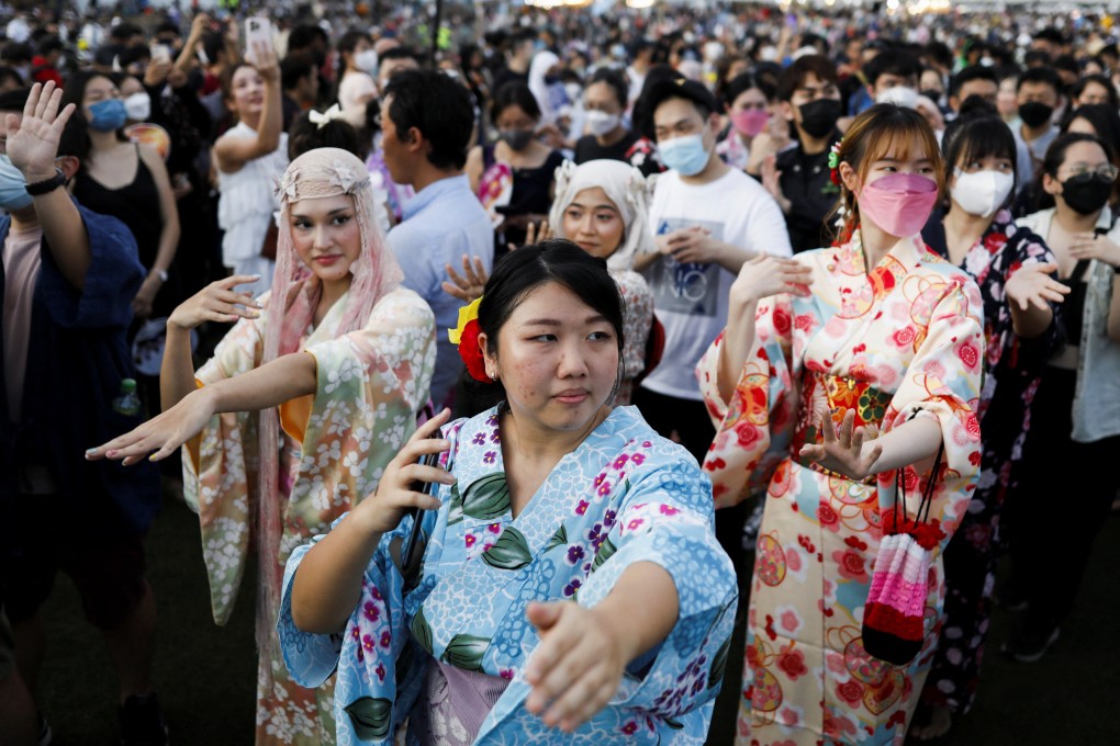 Malaysians and Japanese dance during the Bon Odori festival in Shah Alam, Selangor, on Saturday. Photo: Reuters