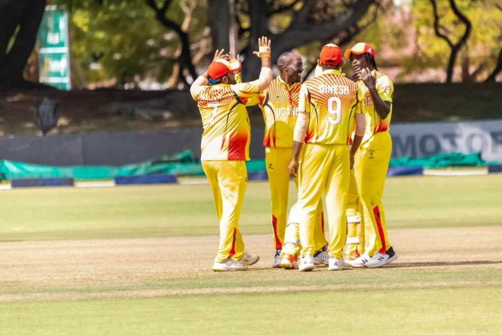 Uganda players celebrate beating Hong Kong in the fifth place play-off game. Photo: Twitter/@CricketUganda