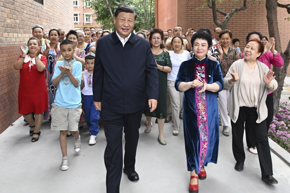 Xi Jinping visits the community of Guyuanxiang in Urumqi. Photo: AP