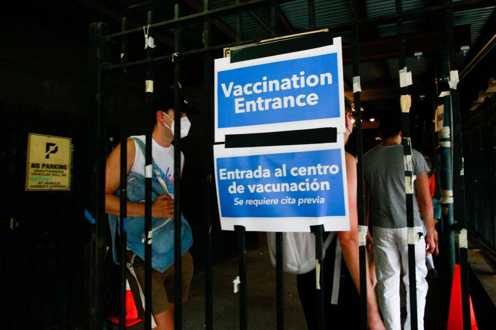 People wait in line to receive the Monkeypox vaccine before the opening of a new mass vaccination site at the Bushwick Education Campus in New York on July 17. File photo: AFP