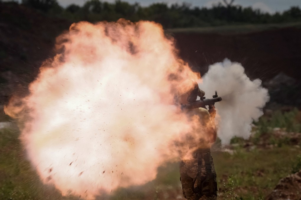 A Ukrainian soldier fires a rocket-propelled grenade (RPG) launcher during a training exercise in Donbas region, Ukraine. Photo: Reuters
