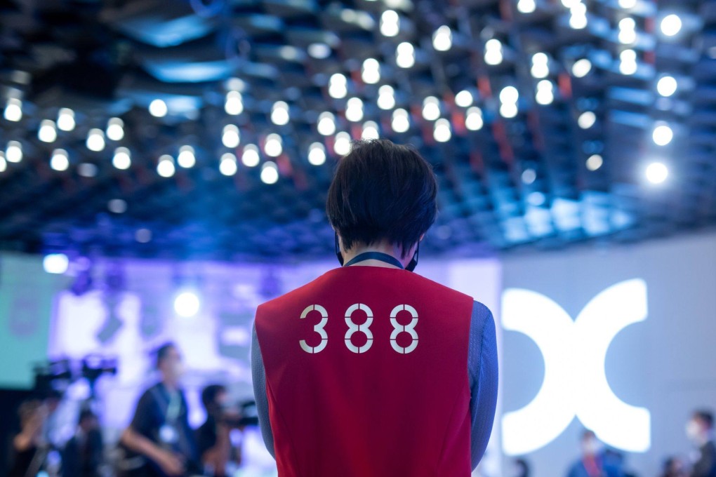 The stock code for Hong Kong Exchanges & Clearing on an employee’s vest at Hong Kong Stock Exchange  in Hong Kong on July 13. Now a global financial hub, Hong Kong has proved to be adaptable and successful. Photo: Bloomberg