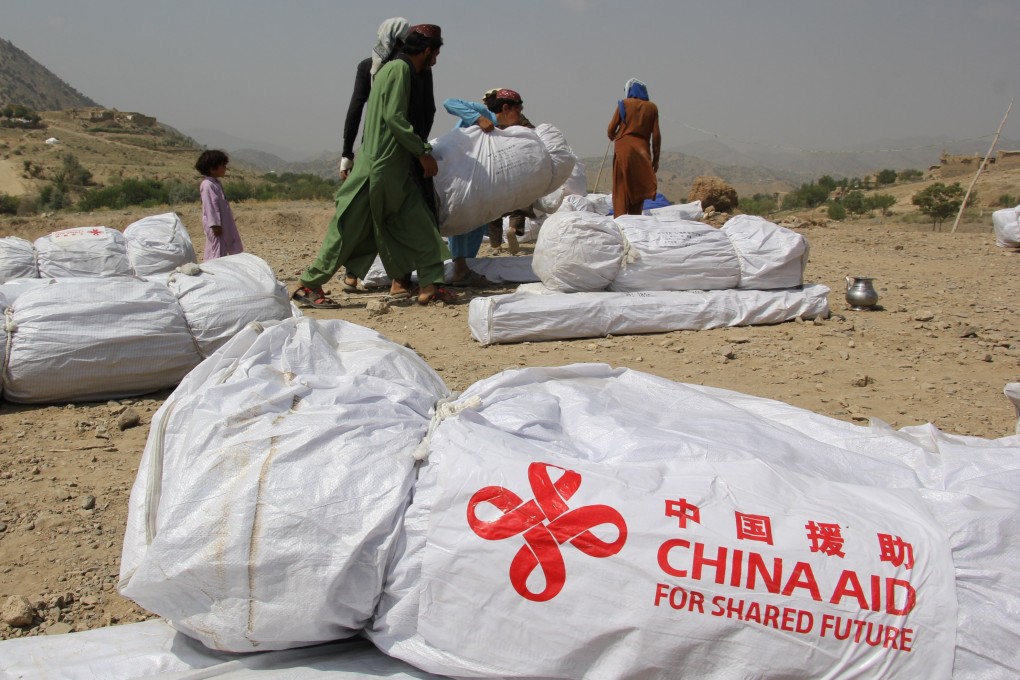 People receive relief supplies donated by China in Afghanistan’s disaster-hit Paktika province on July 2. Photo: Xinhua