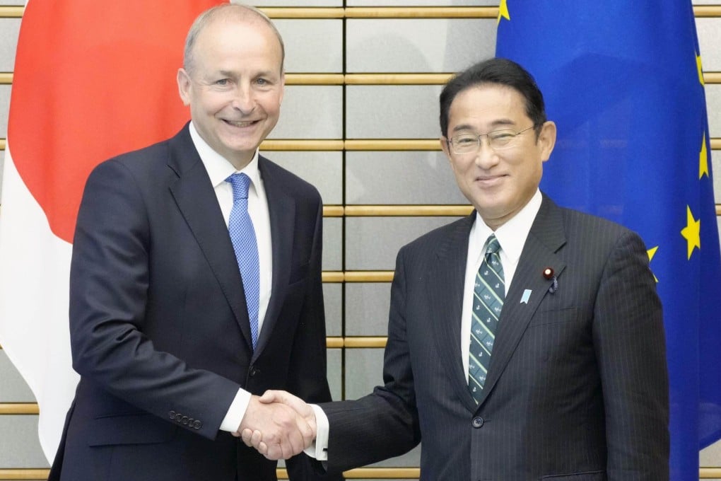Japanese Prime Minister Fumio Kishida and his Irish counterpart Micheal Martin shake hands ahead of their talks in Tokyo on July 20, 2022. Photo: Kyodo