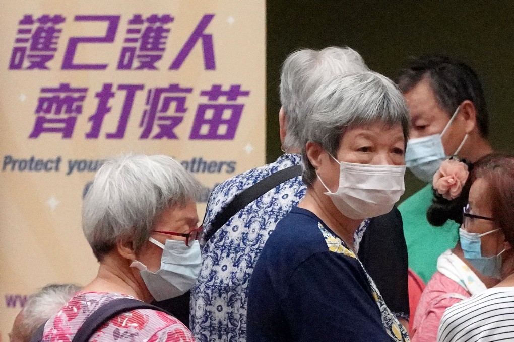 The government’s outreach vaccination team helps elderly residents at Cheung Fat Estate Community Centre in Kwai Tsing district on October 11, 2021. Photo: Winson Wong