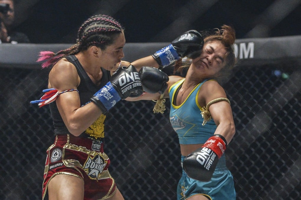 Janet Todd lands a punch on Stamp Fairtex. Photos: ONE Championship.
