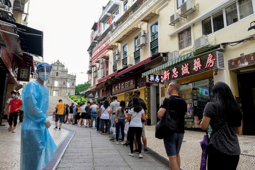 People queue for mass Covid-19 testing near the Ruins of Saint Paul’s, in Macau, on June 20. In the past month, the city has gone to great lengths to manage double-digit daily infections. Photo: Reuters