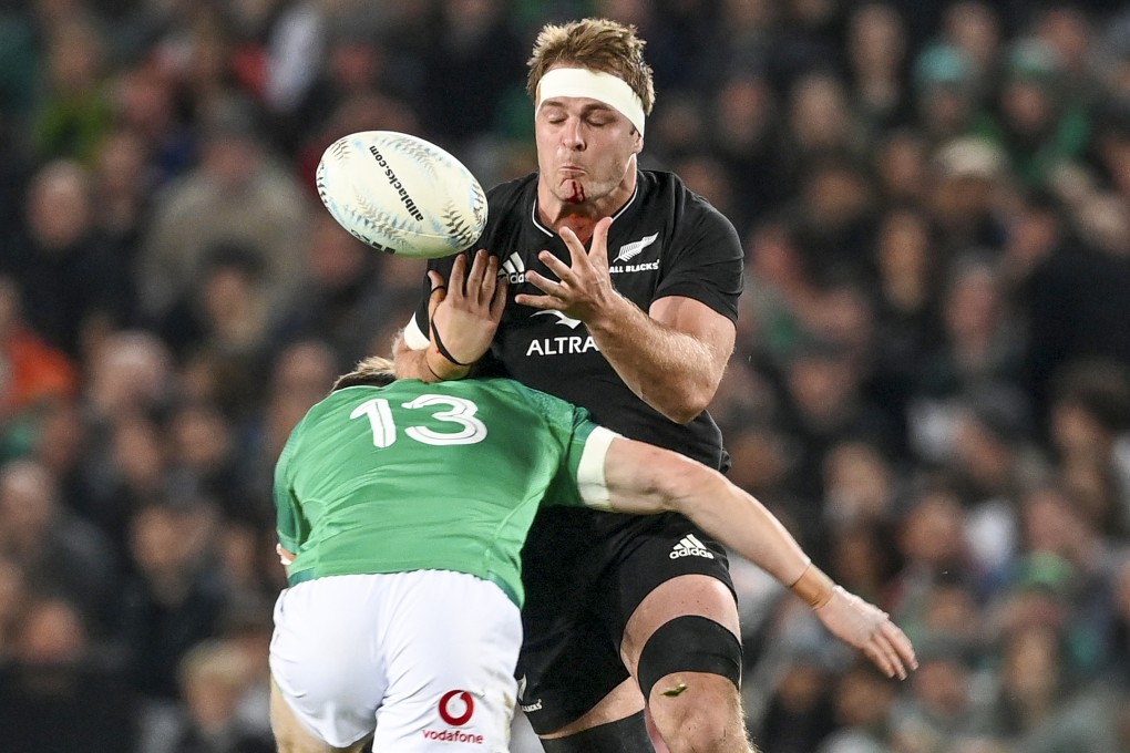 All Blacks captain Sam Cane takes a big hit against Ireland. Photo: AP