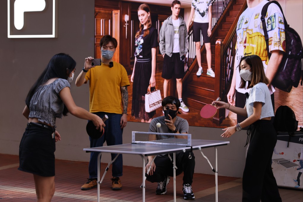 Young people play table tennis on a street in Mong Kok on April 10. Photo: Nora Tam