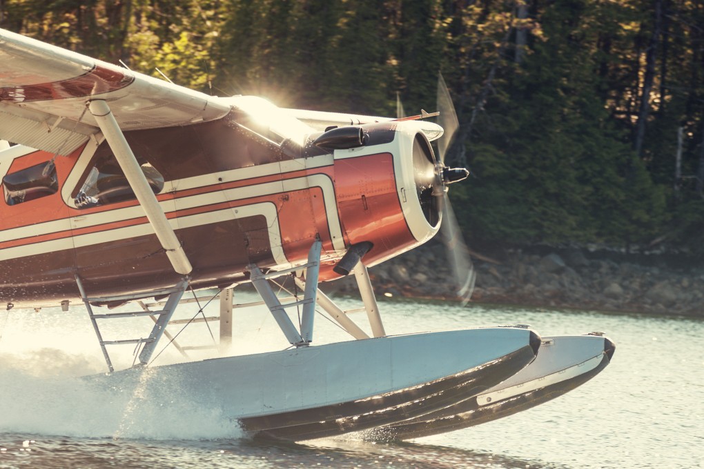 A seaplane throttles up from a still inlet in Alaska, where Rebecca Rukeyser’s debut novel, The Seaplane on Final Approach, is set. Photo: Getty Images