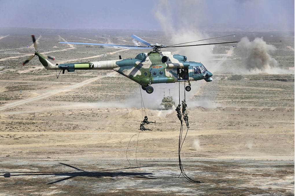 Troops disembark from a helicopter during a Sino-Russian joint military exercise in northwest China in 2021. File photo: Russian Defence Ministry Press Service via AP