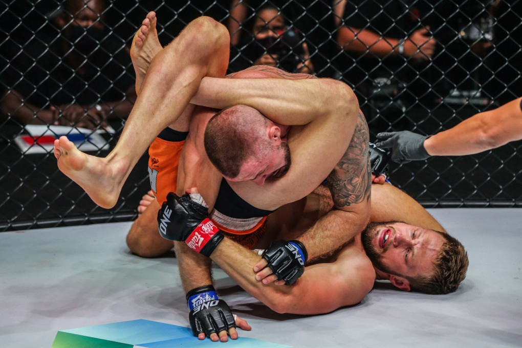 Reinier de Ridder chokes out Vitaly Bigdash to retain his middleweight MMA title at ONE 159. Photos: ONE Championship