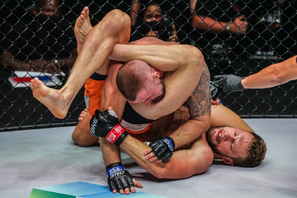 Reinier de Ridder chokes out Vitaly Bigdash to retain his middleweight MMA title at ONE 159. Photos: ONE Championship