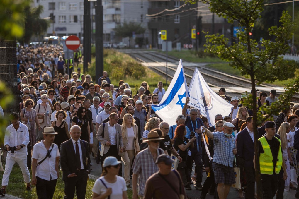 People attend a March of Remembrance during ceremonies on Friday marking the 80th anniversary of the start of Nazi Germany’s mass deportation of Jews from the Warsaw Ghetto to the death camp of Treblinka. Photo: AFP