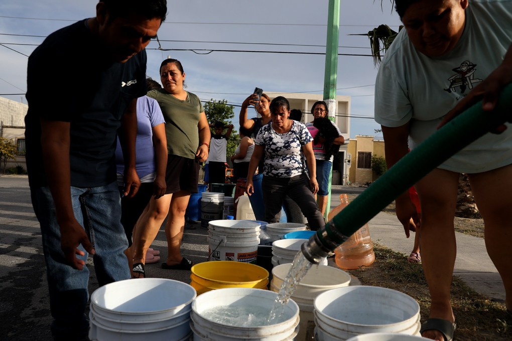 Residents wait in line for water from a delivery truck on the outskirts of Monterrey, a major industrial Mexican city two hours from the US border that is running out of water. Photo: TNS