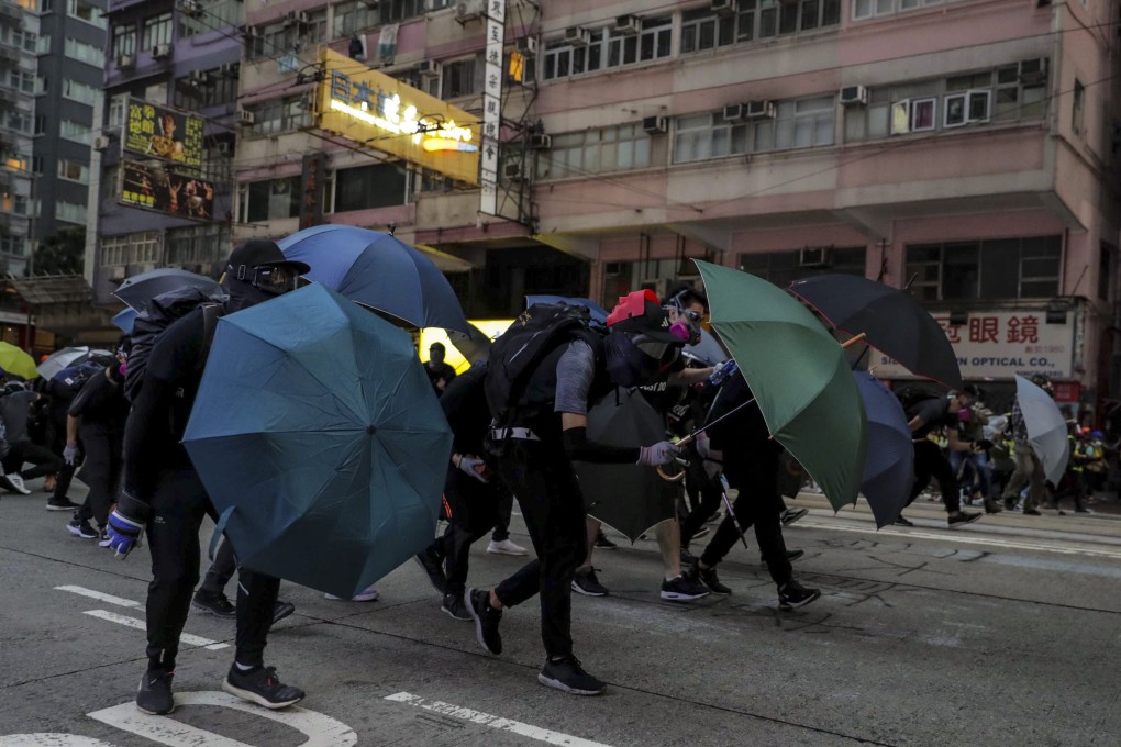 Anti-government protesters clash with riot police in Wan Chai. Photo: Edmond So