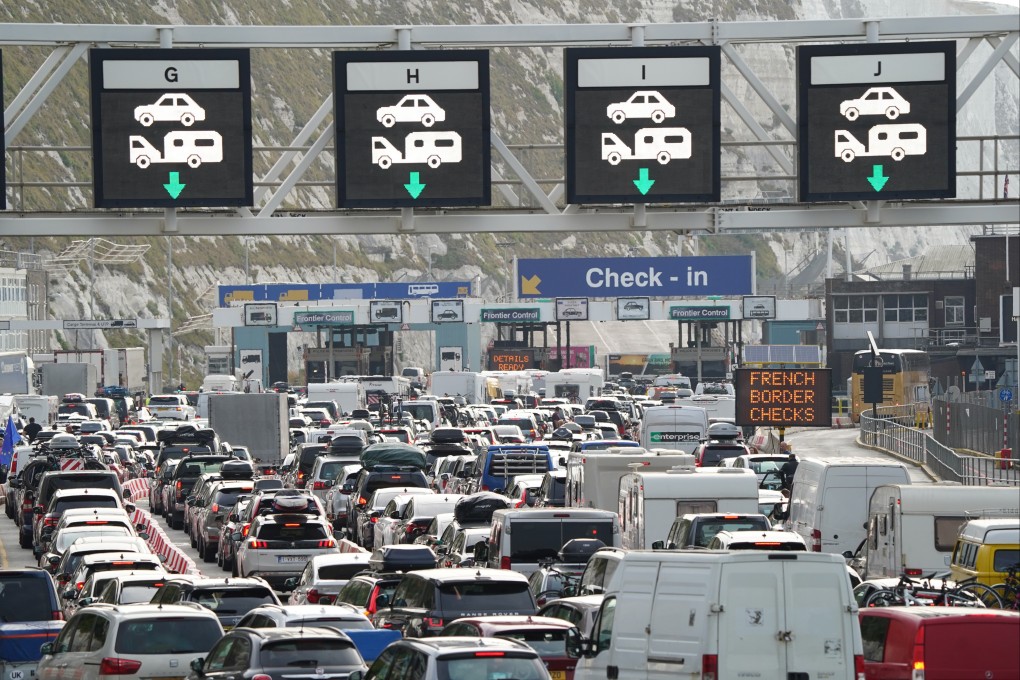 Cars queue at the check-in at the Port of Dover in Kent as many families embark on getaways following the start of summer holidays for many schools in England and Wales. Photo: dpa