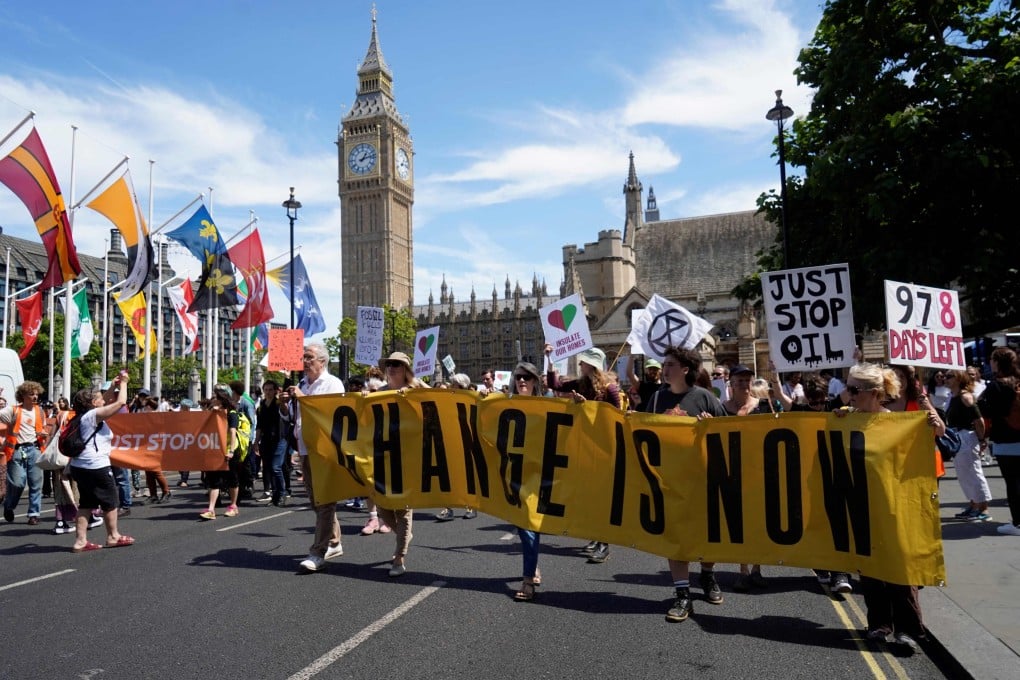 Protesting Uk Protesters take to the streets in Britain to decry climate change after ...