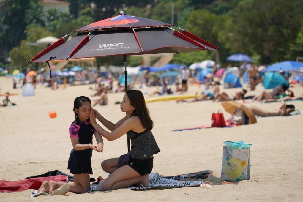 Holidaymakers at Repulse Bay. Hong Kong recorded 36.1 degrees on Sunday, the highest reading for July since records began more than 100 years ago. Photo: Felix Wong