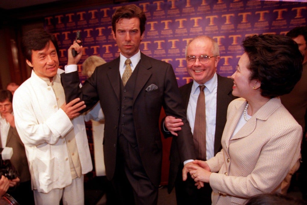 Jackie Chan holds a waxwork model of Pierce Brosnan, with the Commissioner for Tourism Mike Rowse, and executive director of Hong Kong Tourist Association Amy Chan in 2000. Photo: SCMP
