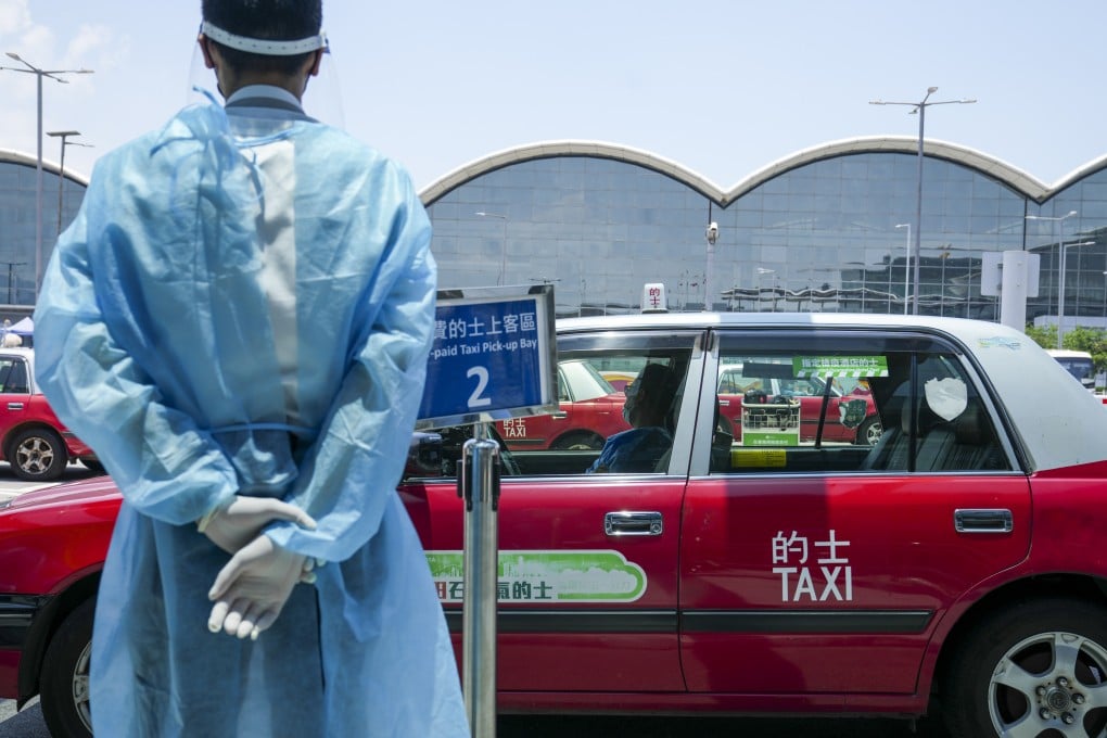 Designated quarantine hotel taxis pick up passengers at Hong Kong International Airport at Chek Lap Kok on Monday. Photo: Sam Tsang