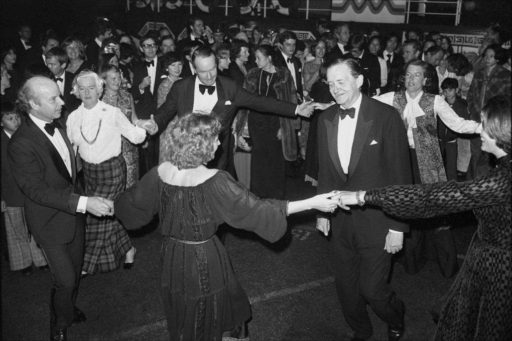 Hong Kong Governor Murray MacLehose becomes the focus of a dancing ring at Jardine Matheson’s annual ball on New Year’s Eve 1977. Access to government inner circles was long the heart’s desire of Hong Kong’s truly dedicated social climbers. Photo: SCMP