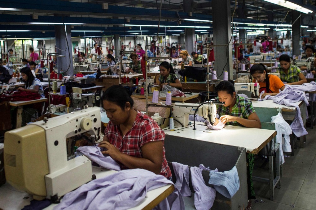 Workers work at a garment factory in Yangon. From factory floors in India to the warehouses of Cambodia, garment workers for global brands say the collapse in demand triggered by the coronavirus is being used as a cover to break their unions. File photo: AFP