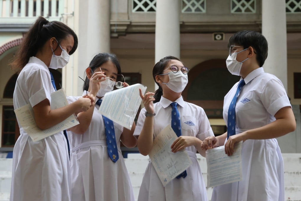 Students at St. Mary’s Canossian College (from left) Charmaine Hung Yuet-yi, Jenna Cheung Yan-ting, Serena Yu Sheung-wing and Jackie Wong Tsz-Li receive their Diploma of Secondary Education examination results on July 21. Photo: May Tse